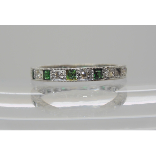 605 - AN 18CT WHITE GOLD GREEN GEM AND DIAMOND ETERNITY RING