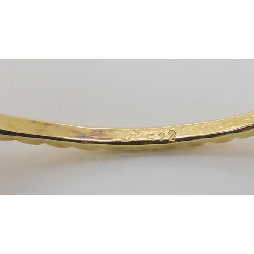 613 - A BRIGHT YELLOW METAL BANGLE