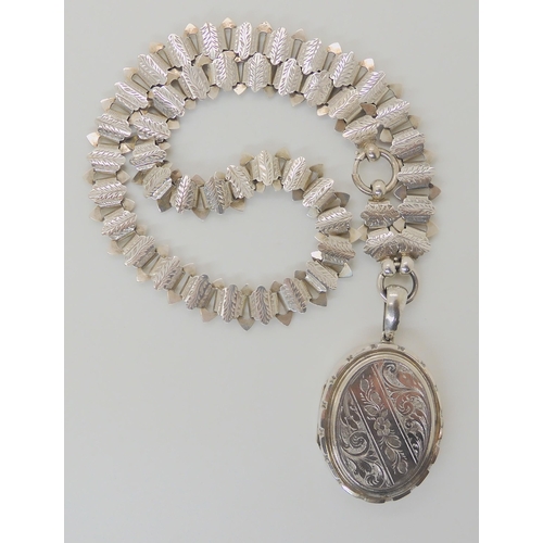617 - A WHITE METAL VICTORIAN LOCKET AND CHAIN