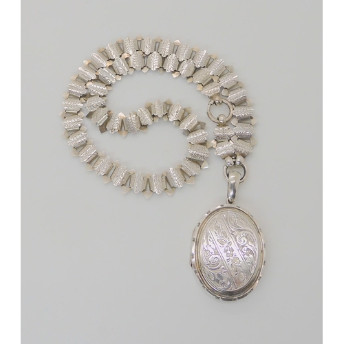 617 - A WHITE METAL VICTORIAN LOCKET AND CHAIN