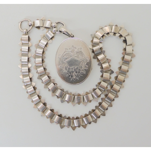 617 - A WHITE METAL VICTORIAN LOCKET AND CHAIN