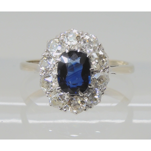 625 - A SAPPHIRE AND DIAMOND CLUSTER RING