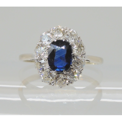 625 - A SAPPHIRE AND DIAMOND CLUSTER RING