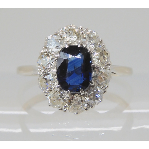 625 - A SAPPHIRE AND DIAMOND CLUSTER RING