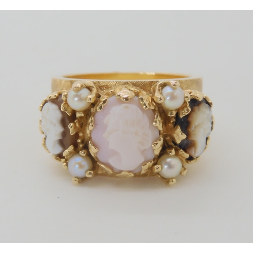 643 - A YELLOW METAL CAMEO TRIO AND PEARL RING