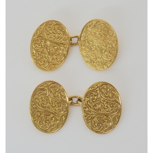 647 - A PAIR OF 18CT VINTAGE FOLIATE ENGRAVED CUFFLINKS