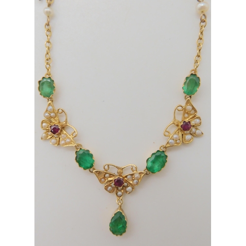 652 - A 15CT GOLD RUBY EMERALD AND PEARL SET MOTH NECKLACE