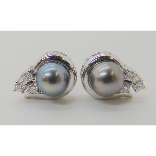 656 - A PAIR OF BLACK PEARL AND DIAMOND EARRINGS