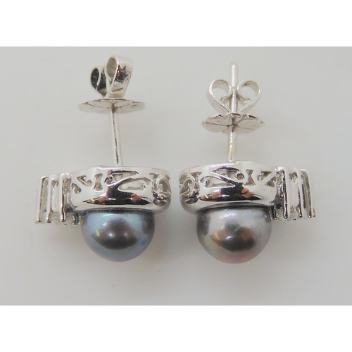 656 - A PAIR OF BLACK PEARL AND DIAMOND EARRINGS