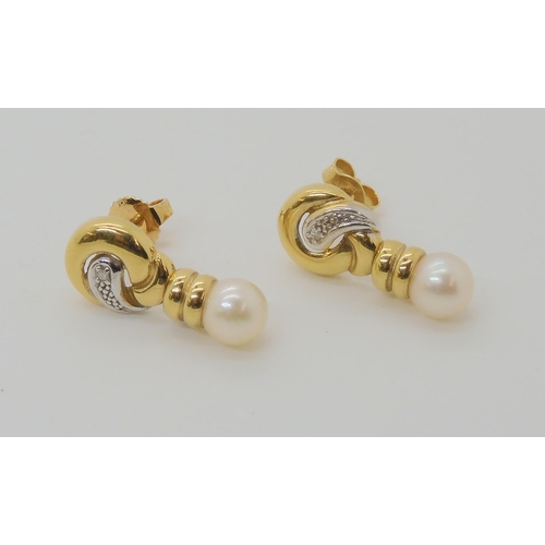 658 - A PAIR OF 18CT GOLD DIAMOND ACCENT AND WHITE PEARL EARRINGS