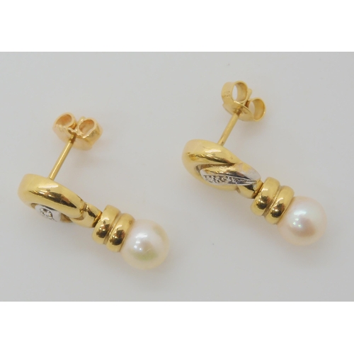 658 - A PAIR OF 18CT GOLD DIAMOND ACCENT AND WHITE PEARL EARRINGS