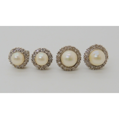 666 - TWO PAIRS OF PEARL AND DIAMOND STUD EARRINGS