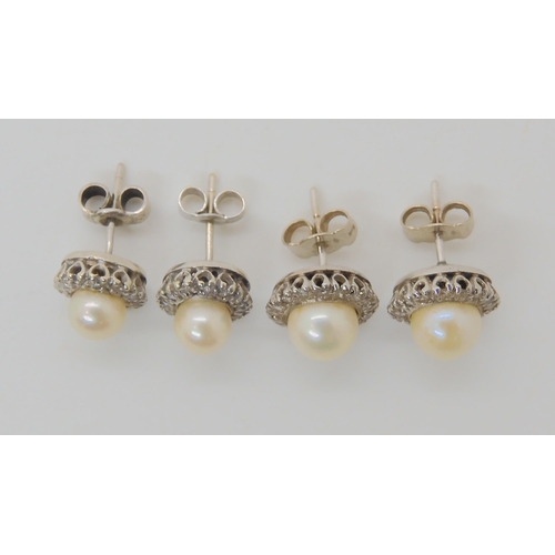 666 - TWO PAIRS OF PEARL AND DIAMOND STUD EARRINGS