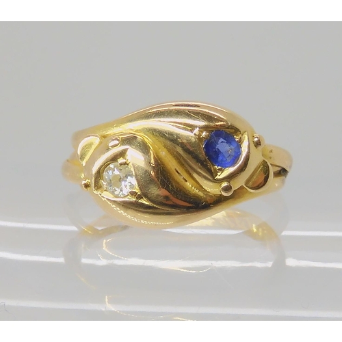 672 - AN 18CT GOLD SAPPHIRE AND DIAMOND SNAKE RING