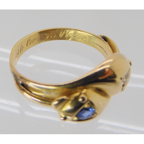 672 - AN 18CT GOLD SAPPHIRE AND DIAMOND SNAKE RING