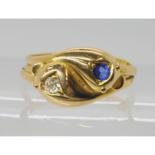 672 - AN 18CT GOLD SAPPHIRE AND DIAMOND SNAKE RING