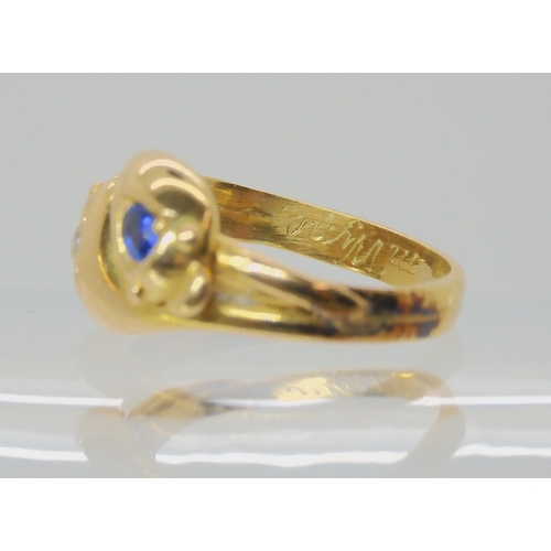 672 - AN 18CT GOLD SAPPHIRE AND DIAMOND SNAKE RING