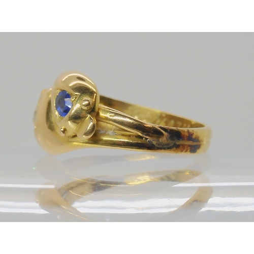 672 - AN 18CT GOLD SAPPHIRE AND DIAMOND SNAKE RING