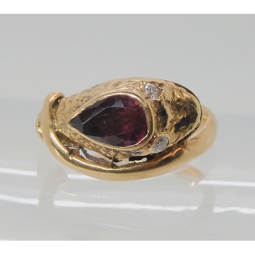 675 - A 9CT ROSE GOLD GARNET AND DIAMOND SNAKE RING