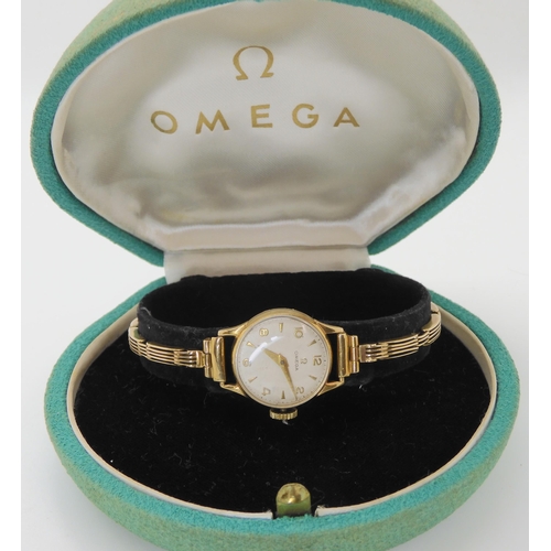 703 - A 9CT GOLD LADIES VINTAGE OMEGA WRISTWATCH