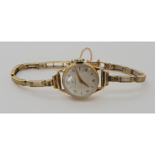 703 - A 9CT GOLD LADIES VINTAGE OMEGA WRISTWATCH