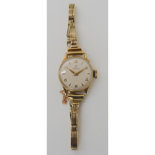 703 - A 9CT GOLD LADIES VINTAGE OMEGA WRISTWATCH