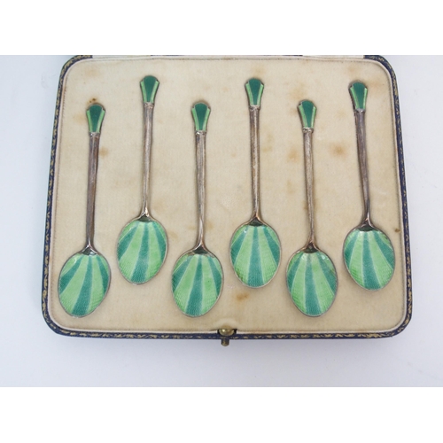 736 - A CASED SET OF SIX SILVER GILT AND ENAMEL COFFEE SPOONS