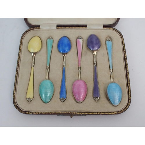 736 - A CASED SET OF SIX SILVER GILT AND ENAMEL COFFEE SPOONS