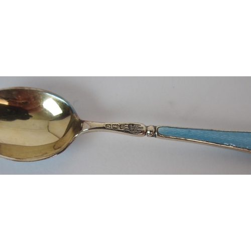 736 - A CASED SET OF SIX SILVER GILT AND ENAMEL COFFEE SPOONS