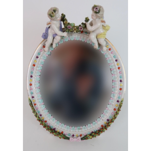 263 - A CONTINENTAL MEISSEN STYLE OVAL DRESSING TABLE MIRROR