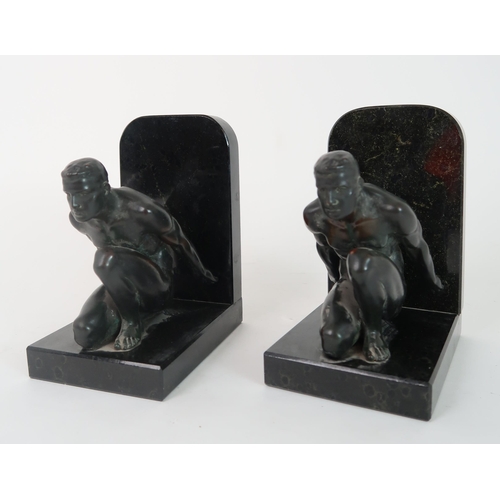 283 - A PAIR OF BRONZE BOOKENDS