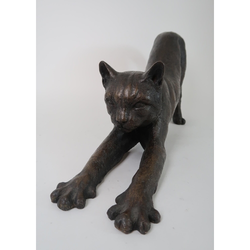 288 - A BRONZED SCULPTURE OF A STRETCHING CAT