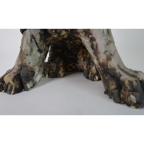 290 - OLIVIA BROWN - A CERAMIC SCULPTURE OF A TERRIER CROSS