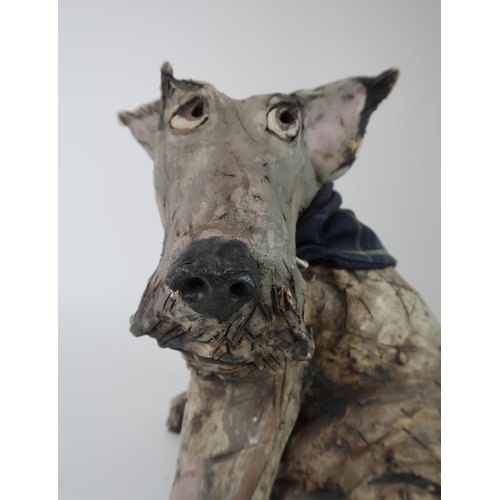 290 - OLIVIA BROWN - A CERAMIC SCULPTURE OF A TERRIER CROSS