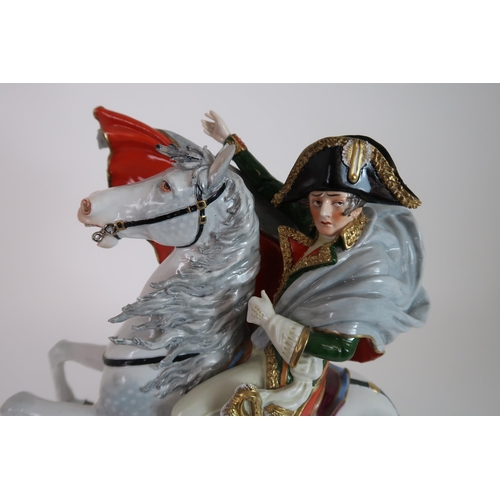 296 - A SITZENDORF FIGURE OF NAPOLEON CROSSING THE ALPS