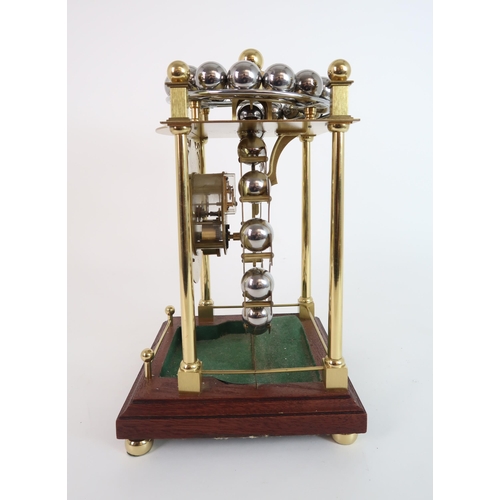 308 - A LATE 20TH CENTURY SPHERICAL WEIGHT CLOCK BY HARDING AND BAZELEY  CHELTENHAM