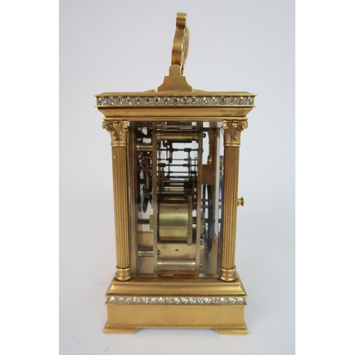 321 - A FRENCH GILDED METAL AND PASTE SET REPEATER CARRIAGE CLOCK