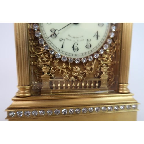 321 - A FRENCH GILDED METAL AND PASTE SET REPEATER CARRIAGE CLOCK