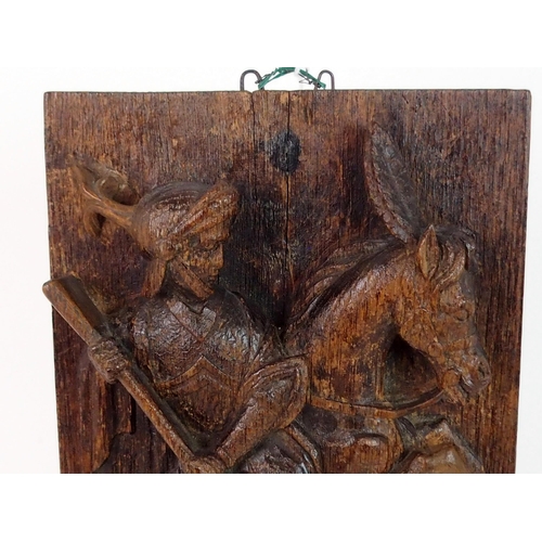 376 - AN EARLY CARVED OAK PANEL DEPICTING GEORGE AND THE DRAGON