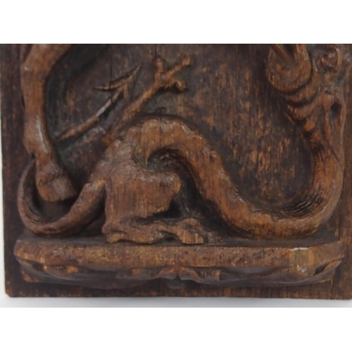 376 - AN EARLY CARVED OAK PANEL DEPICTING GEORGE AND THE DRAGON