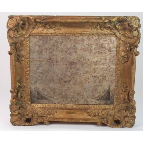 379 - AN EARLY CARVED FRAME WITH MIRROR PLATE