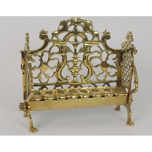 382 - A BRASS HANUKKAH WITH PIERCED BACK PLATE