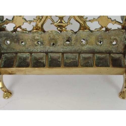 382 - A BRASS HANUKKAH WITH PIERCED BACK PLATE