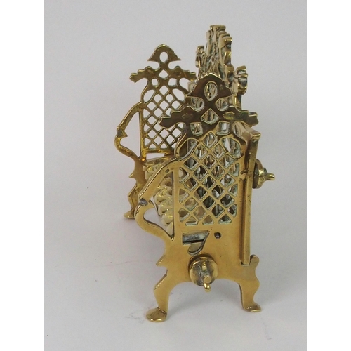 382 - A BRASS HANUKKAH WITH PIERCED BACK PLATE