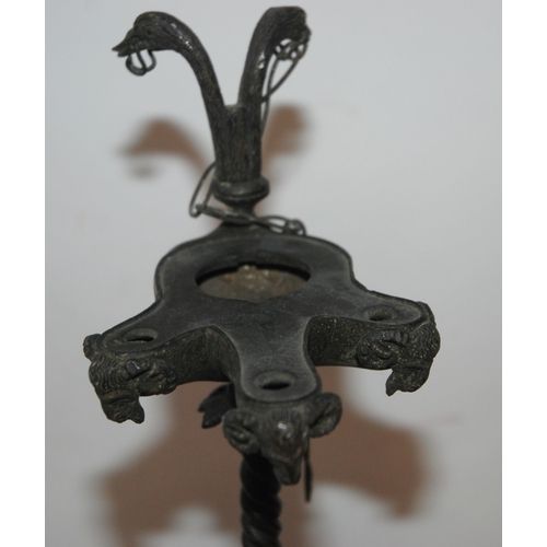 417 - A BRONZE OIL LAMP