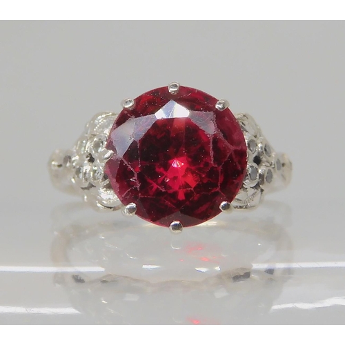 495 - AN 18CT WHITE GOLD FAUX RUBY AND DIAMOND RING