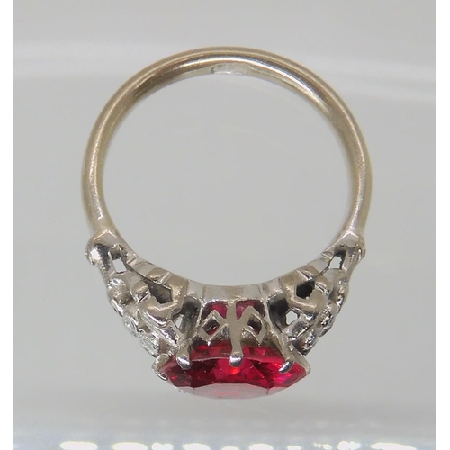 495 - AN 18CT WHITE GOLD FAUX RUBY AND DIAMOND RING