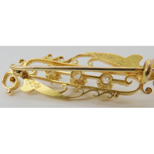 502 - A 15CT GOLD THREE DIAMOND BROOCH