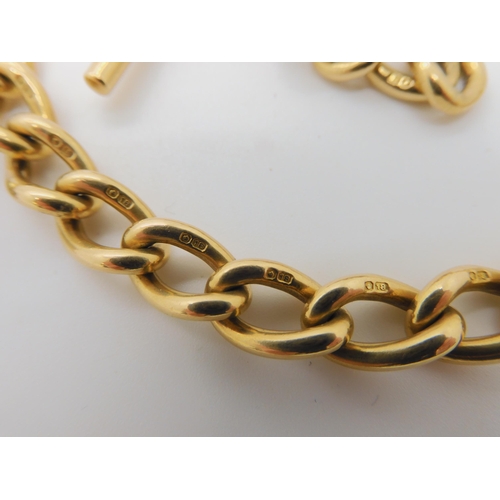 523 - AN 18CT GOLD FOB CHAIN BRACELET