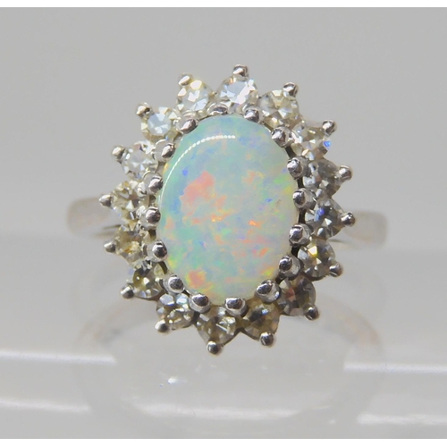 526 - AN 18CT WHITE GOLD OPAL AND DIAMOND RING